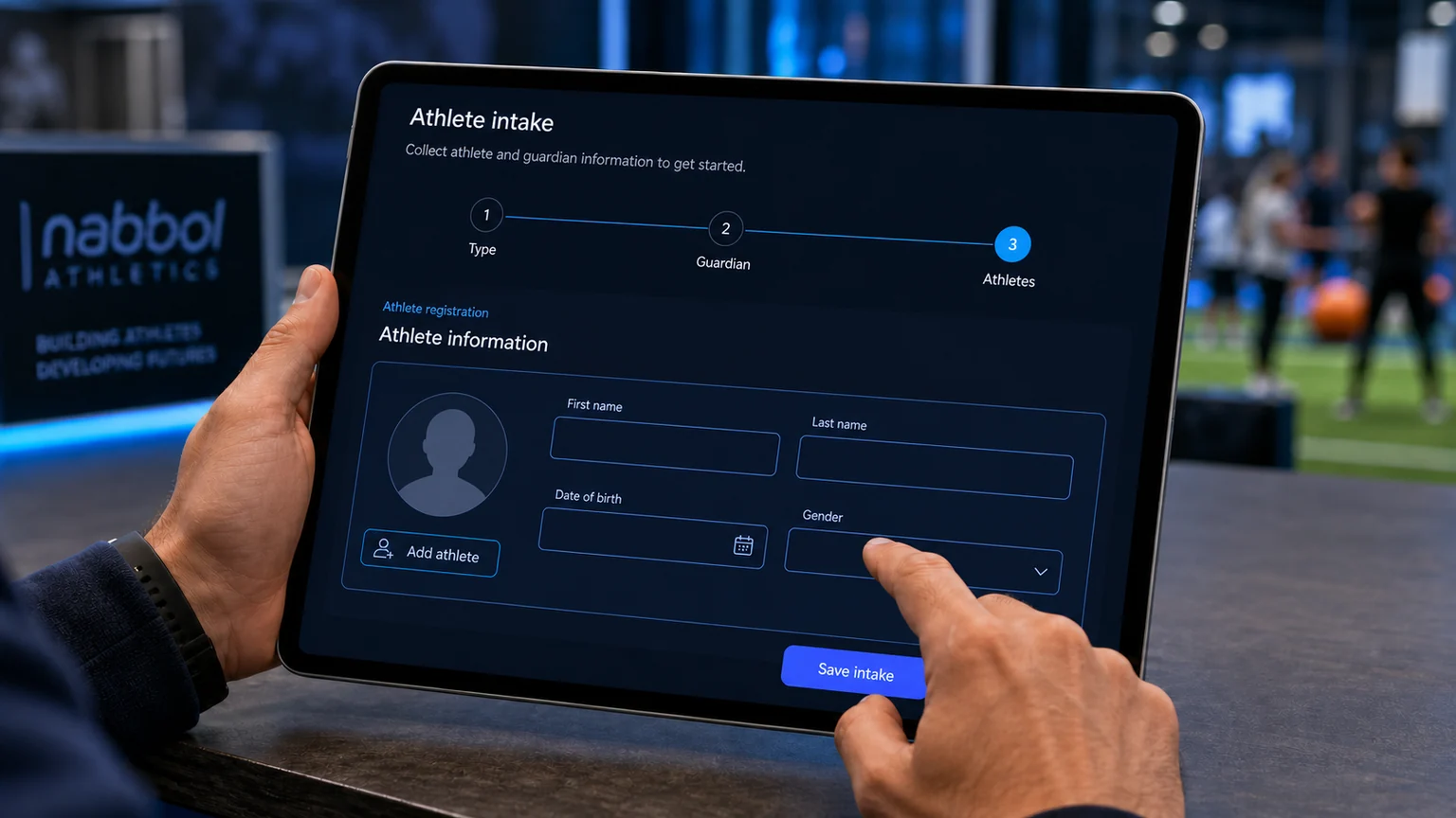 User completing athlete and guardian intake information on a tablet with Nabbol Athletics